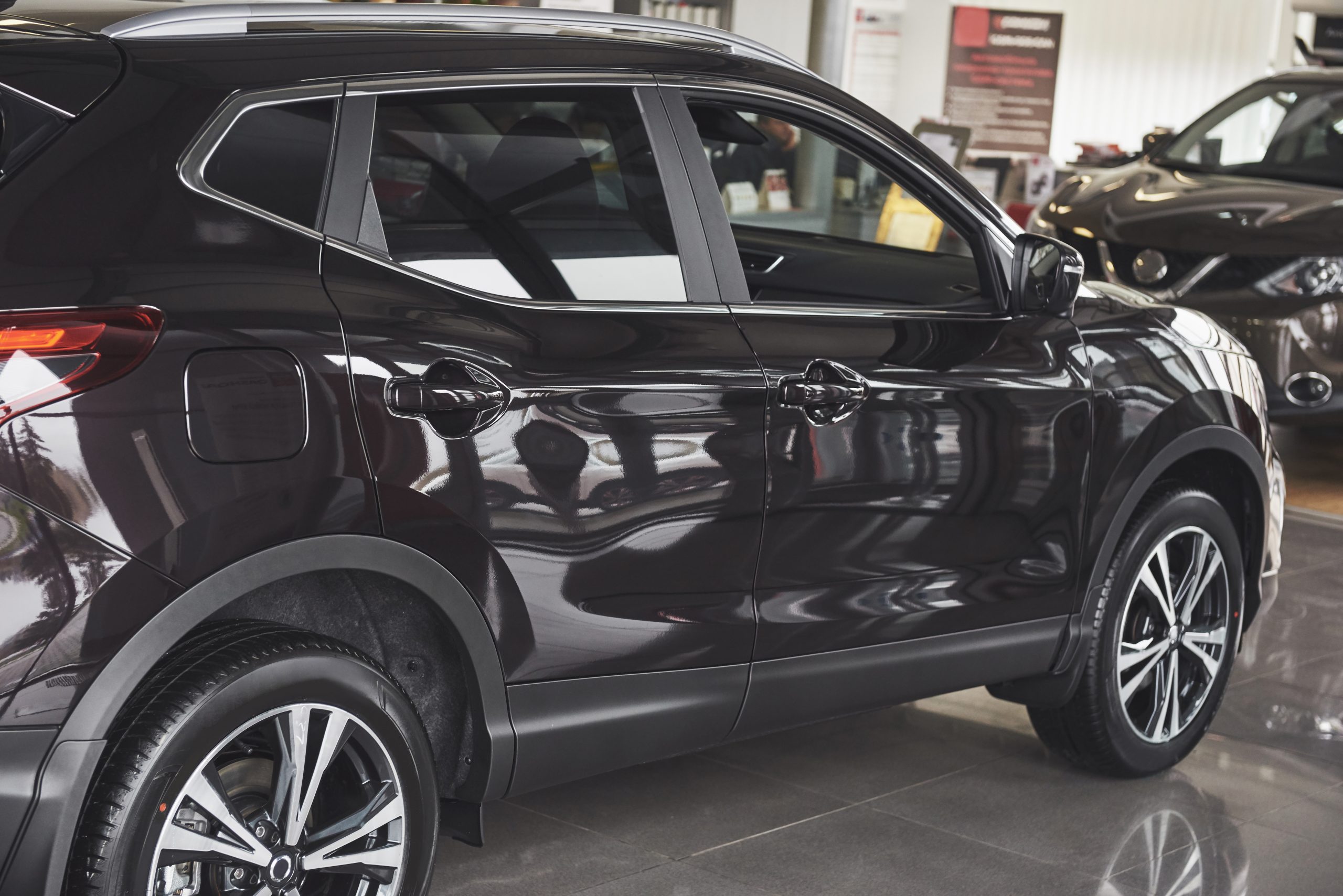 the back headlights of a black luxury car
